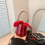 Vvsha Mini Exquisite Wine Red Glossy Lacquer Surface Crossbody Bag 2024 New Bow Drawstring Underarm Bags High Street Lipstick Handbag