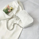 Vvsha This white elegant and gentle chain underarm bag for women is foreign-style, simple and a small square bag. It's a fashionable a